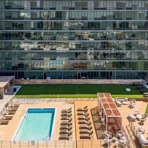 a building with a pool and a courtyard area