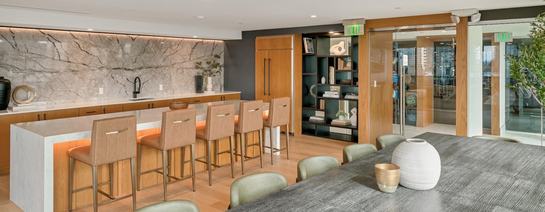 a clubroom with a table and chairs