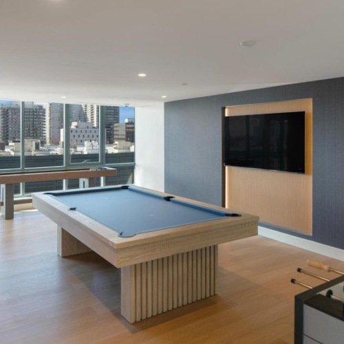 a game room with a pool table and a foosball table