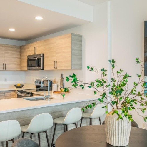 a kitchen with a table and chairs