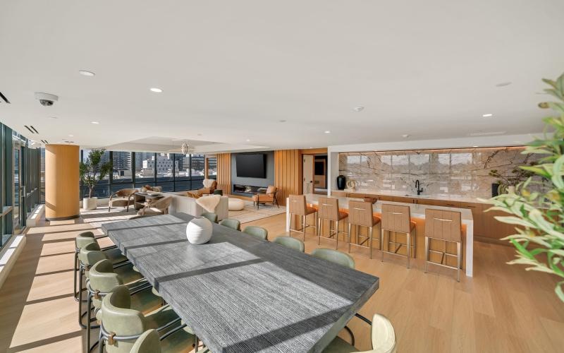 a clubroom with a table and chairs